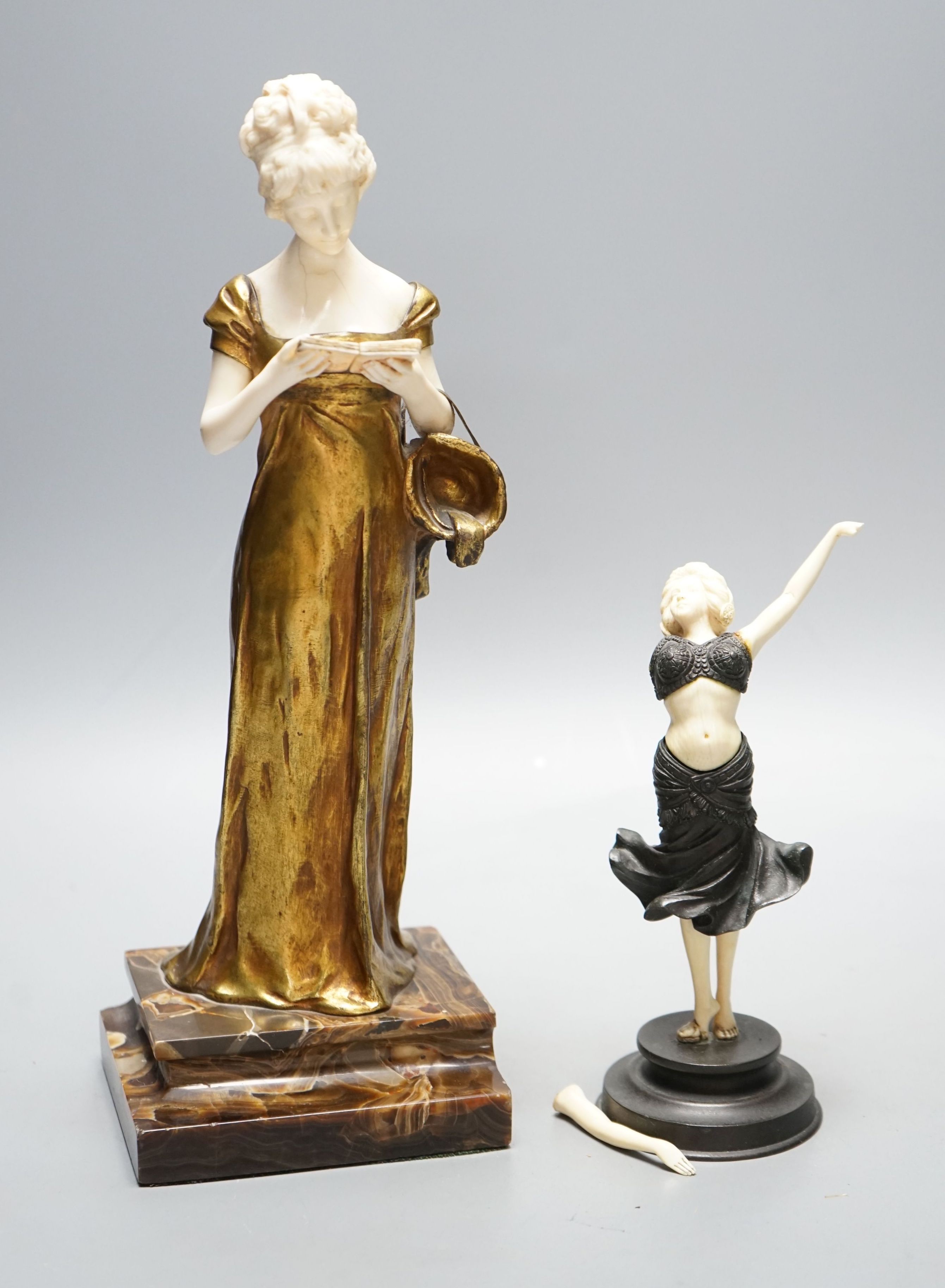 Georges Van Der Straeten, Belgian 1856-1928, An Art Deco bronze and ivory figure of a girl reading a book together with a smaller bronze and ivory figure, Tallest 31.5 cms high.